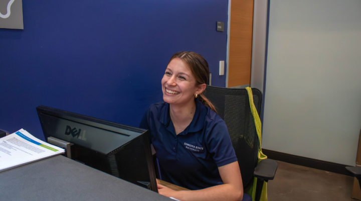 Student giving information at the student center desk