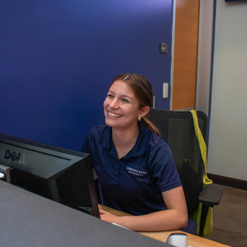 Student giving information at the student center desk
